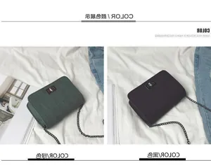 Detail of dark green and black textured chain bags with metallic twist locks on bed