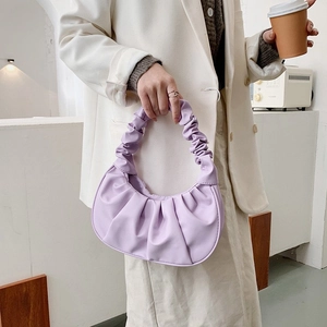 Elegant purple pleated dumpling bag with soft handle, perfect for stylish women