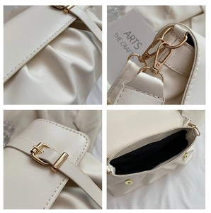 Macro details of cream ruched leather bag showing gold hardware and magnetic closure