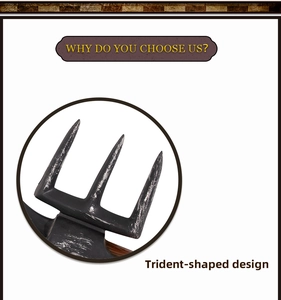 Detail of trident-shaped Viking prop with matte black finish and rustic wooden handle