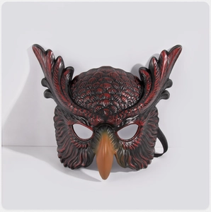 Detailed view of red owl mask featuring realistic feather texture and a black elastic band