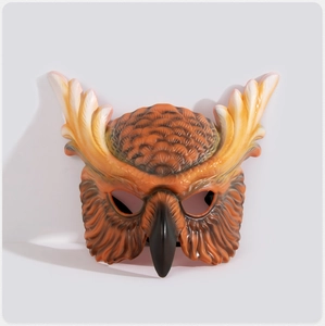 Detailed view of owl carnival mask featuring realistic feather textures and sharp beak