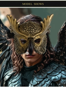 Detail of golden owl mask with metallic feathers and 3D beak for festival cosplay