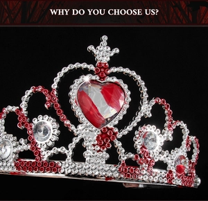 Detailed macro view of heart-shaped silver alloy crown with red gems and rhinestones