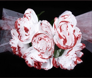 Detail view of bloody white roses and mesh veil for Halloween ghost bride cosplay costume