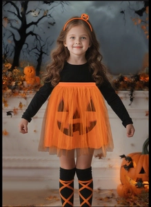 Close-up of Halloween pumpkin TUTU dress set with matching headband and striped socks