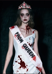 Detail of Halloween Prom Queen sash with blood splatter and red heart jewel crown