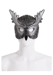 Detail shot of the vintage silver owl mask with realistic feather textures for parties