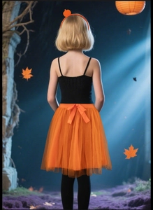 Detail of Halloween pumpkin tutu skirt and matching orange headband for kids party costume