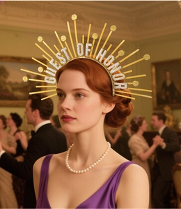 Detail of gold sunburst headband with GUEST OF HONOR lettering for goddess cosplay