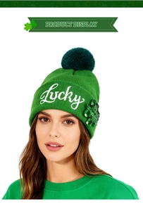 Detail of green knit beanie with Lucky embroidery and sequined shamrock for St. Patrick’s Day