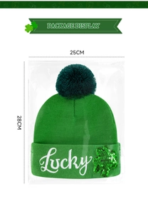 Detail of St. Patrick's Day green knit beanie with Lucky embroidery in packaging