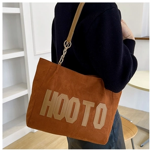 Brown suede-texture tote bag with embroidered letters and gold chain shoulder strap details