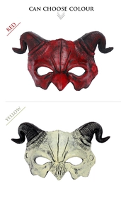 Detail view of devil horn half-mask in red and bone colors for carnival parties