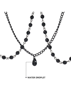 Detail of gothic style black beaded chain with a sleek water droplet pendant decoration