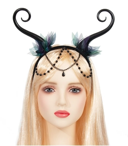 Detailed view of black gothic horns with purple mesh flowers and beaded teardrop pendants