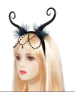 Close-up of gothic demon horn headband with purple lace flowers and black beaded chains