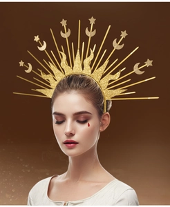 Detail of golden sun and moon goddess headband with star accents for runway fashion