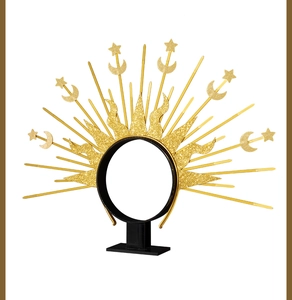 Detailed view of golden sunburst halo crown with stars and moon glitter finish