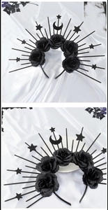 Close-up of Gothic black rose headband with radiating star and moon celestial accents