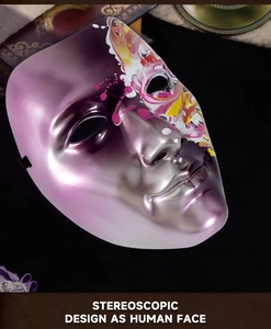 Close-up of stereoscopic purple masquerade mask with colorful paint splatter art
