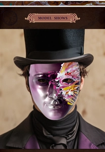 Detail of hand-painted purple and silver masquerade mask with artistic splatter texture