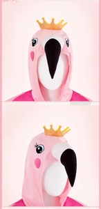 Detail of pink flamingo hood featuring a gold crown and embroidered facial features