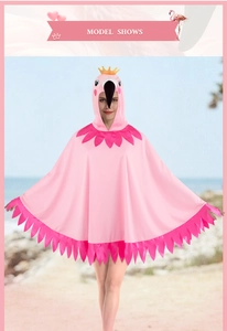 Detail of pink flamingo hooded cape featuring cartoon crown and feather trim