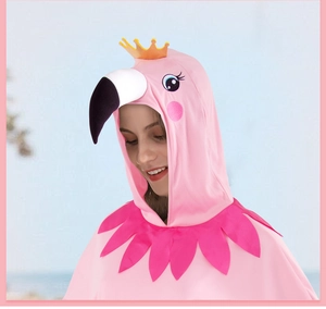 Detail of flamingo hooded cloak featuring a cartoon head design and soft fabric texture