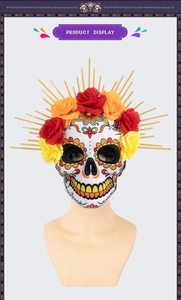 Detail of Day of the Dead EVA mask featuring colorful floral crown and gold sunburst spikes