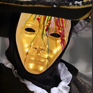 Venice style golden party mask with colorful paint drips and black lace pirate hat set