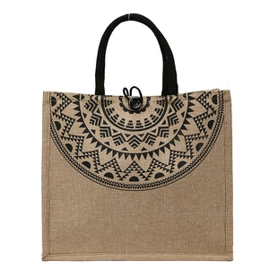 Minimalist jute tote bag with ethnic pattern and black handles on white background