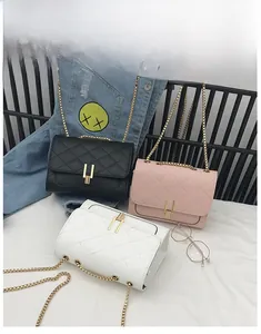 Three elegant quilted chain bags in black, pink, and white with golden metal locks