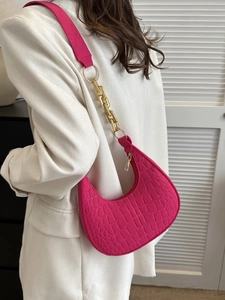 Hot pink faux crocodile leather crescent underarm bag with gold chain and wide strap
