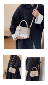 Detail of light beige PU leather bag featuring woven texture and crossbody strap