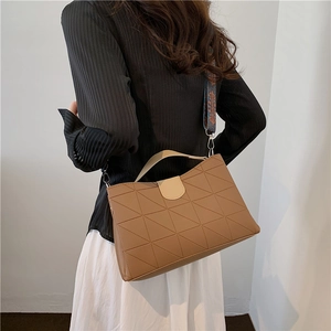 Caramel brown quilted satchel bag with geometric stitching and ethnic pattern wide strap