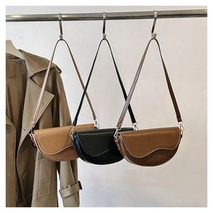 Three minimalist faux leather saddle bags in brown, black, and coffee with adjustable straps