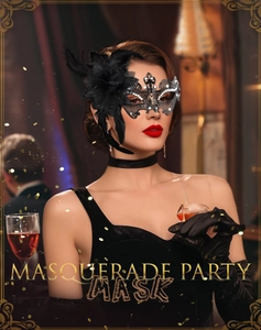 Detail of masquerade mask with black feathers, hollow filigree design and crystals