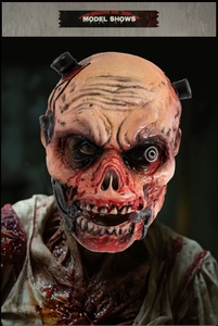Detailed close-up of zombie mask with mechanical cybernetic eye and rotting flesh texture