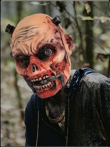 Macro detail of realistic zombie mask with cyberpunk mechanical parts and bloody textures