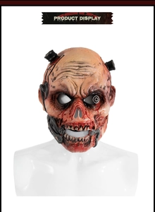 Detail of realistic latex zombie mask with mechanical parts and bloody textures
