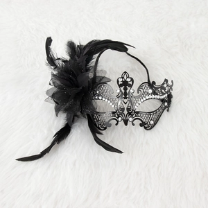 Elegant black metal masquerade mask with ornate feathers and sparkling rhinestones