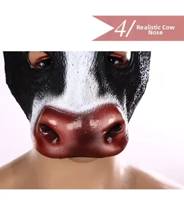 Macro detail of the realistic 3D foam cow mask showing textured snout and eye cutouts