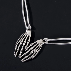 Silver gothic skeleton hand necklace pendant with realistic bone details for Halloween