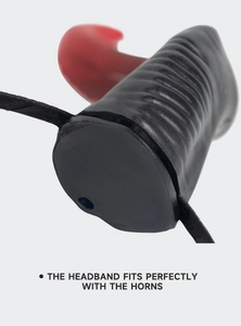 Detailed macro view of red and black devil horn attachment for Halloween headband