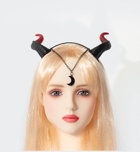 Detail of Halloween devil horns headband with red-black gradient and crescent moon chain
