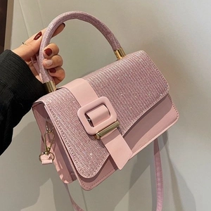 Pink PU leather crossbody bag with shimmering rhinestone cover and gold square buckle