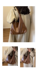 Detail showing the textured dark brown faux leather material and wide shoulder strap of the tote