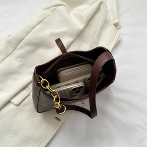 Brown PU leather shoulder bag interior showing spacious capacity for phone and wallet