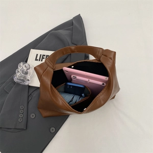 Top view of large brown tote bag showing capacity for tablet, phone and umbrella